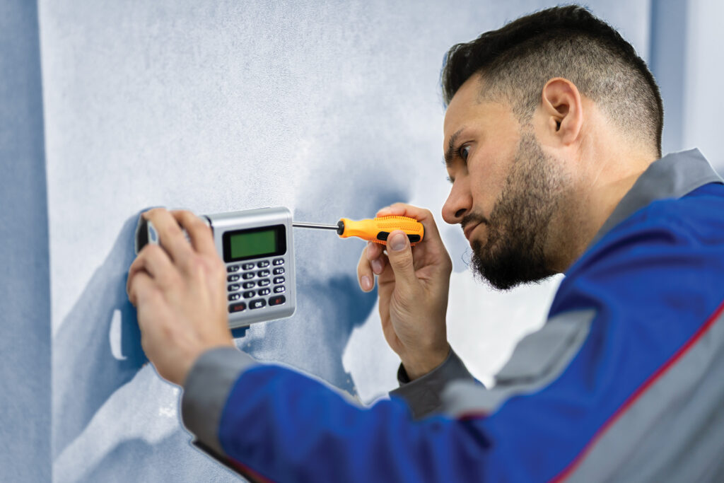 Engineer fitting Alarm
